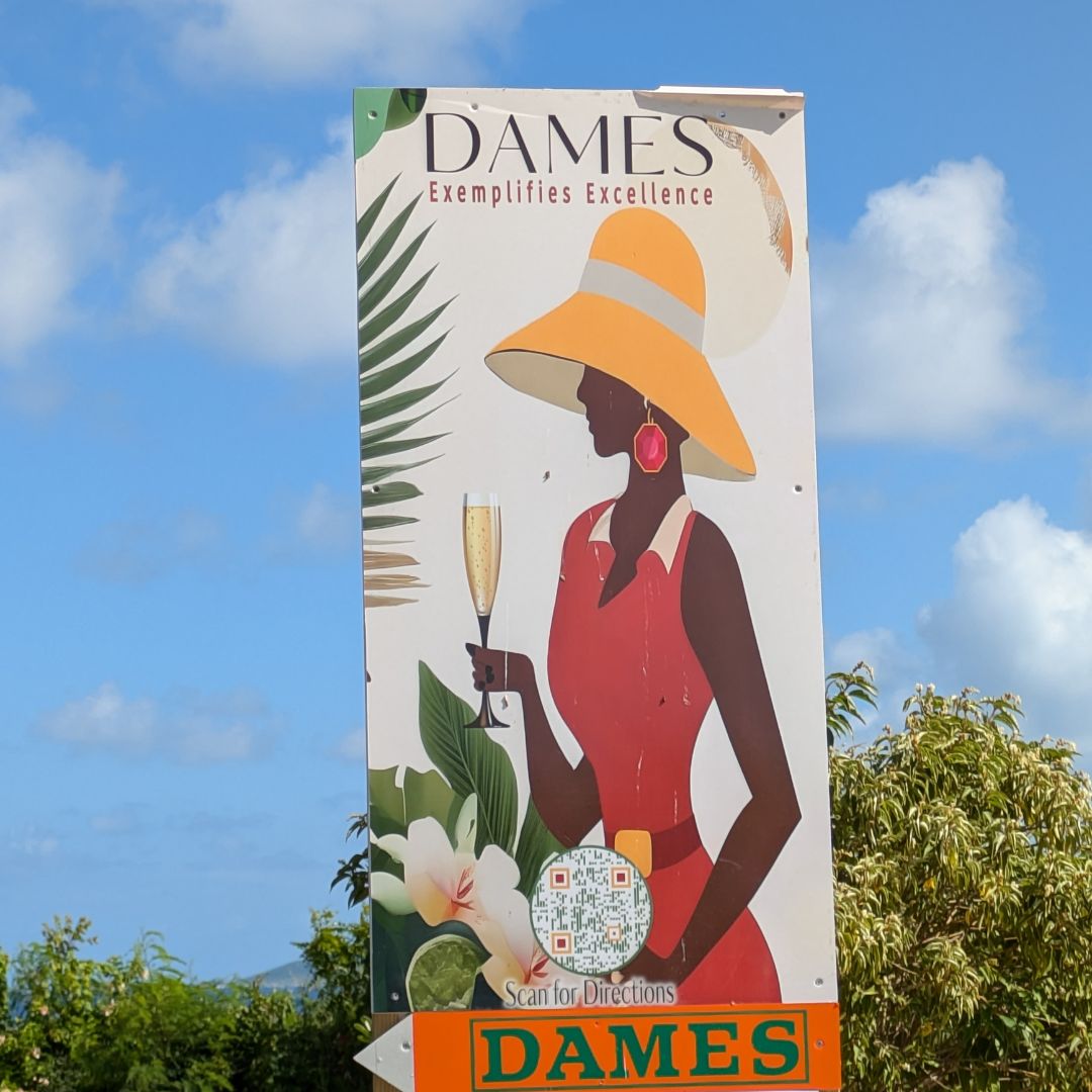 Entry sign to Dames restaurant showing a woman dining